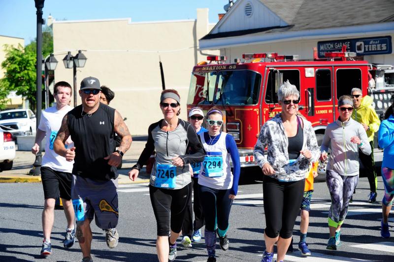 Rounding the corner at an Irish Eyes 5K in Milton are Burli, Ingrid and Amy Hopkins.